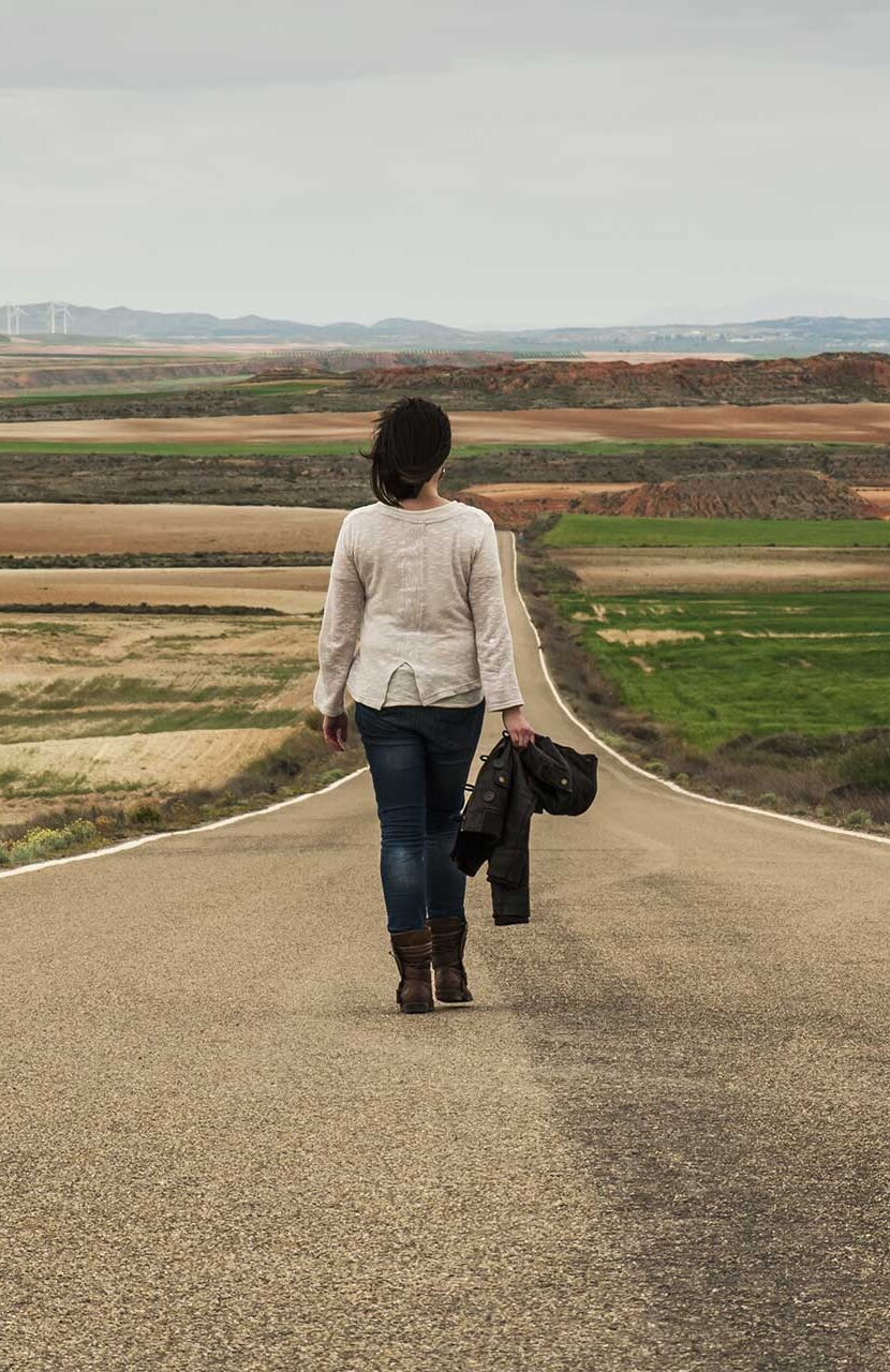 Image of Lady walking on Country Road
